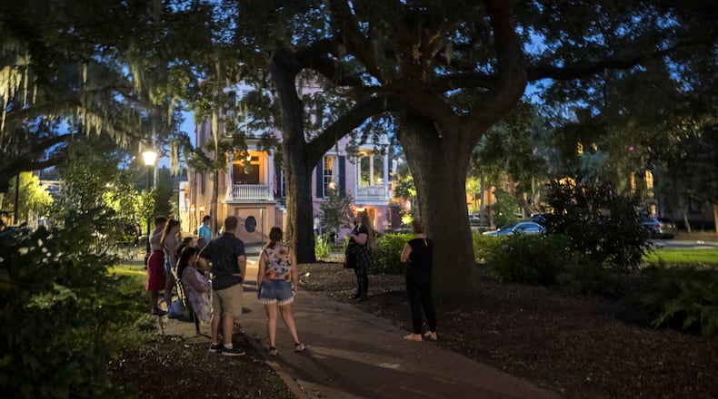 A ghost tour stops in the square formerly known as Calhoun Square in the heart of the landmark historic district in Savannah. (AJC Photo/Stephen B. Morton)
