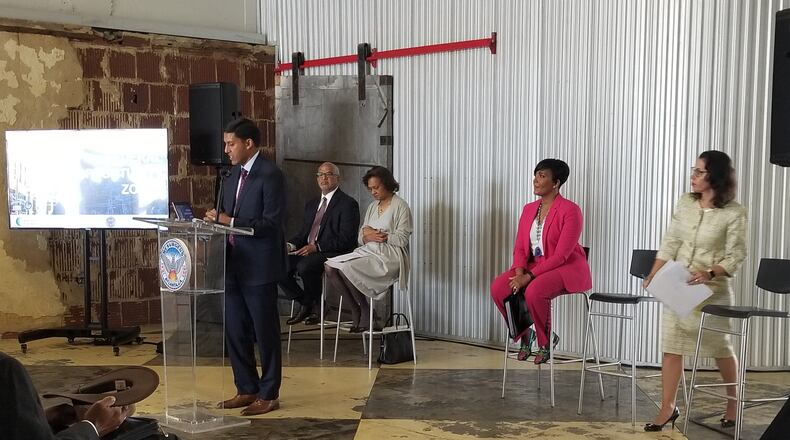 Atlanta Mayor Keisha Lance Bottoms listens as Rockefeller Foundation President Rajiv J. Shah announces a $1 million award to help the city attract investment in economically distressed areas.