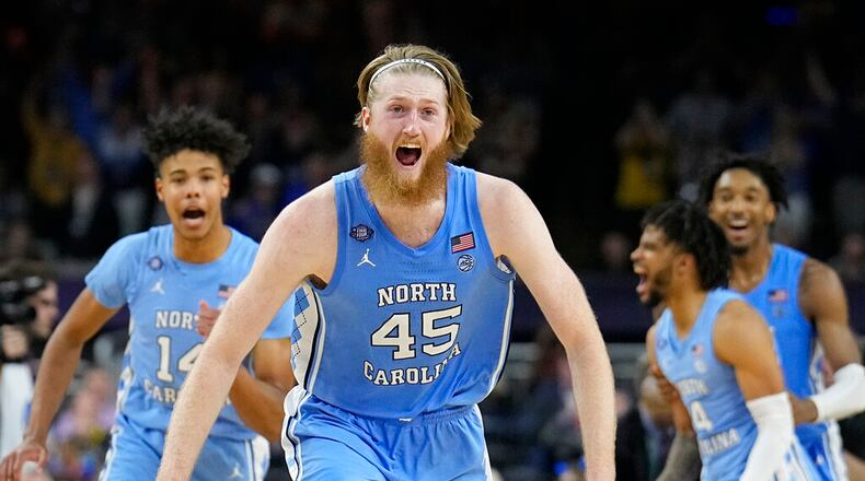 North Carolina's Brady Manek (45) celebrates after beating Duke in a college basketball game during the semifinal round of the Men's Final Four NCAA tournament, Saturday, April 2, 2022, in New Orleans. (AP Photo/David J. Phillip)
