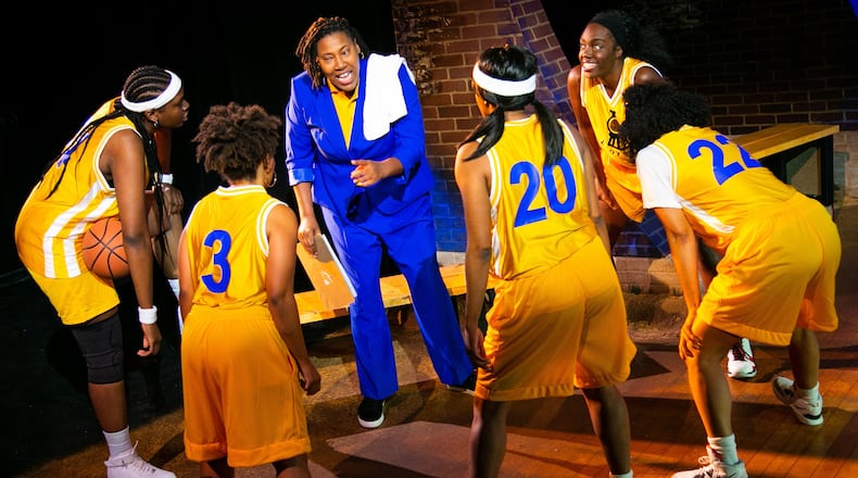 Andrea Gooden (center) plays the coach of a girls' high school basketball team in the world premiere co-production of "Flex," continuing through Oct. 2 at Theatrical Outfit.
(Courtesy of Theatrical Outfit/Casey Gardner Ford Photography)