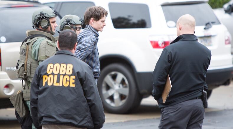A 31-year-old Marietta man was arrested Sunday after a brief standoff at the townhouse where he lives.