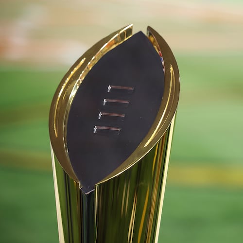 FILE - The College Football Playoff National Championship Trophy is shown before the Cotton Bowl College Football Playoff semifinal game between Texas and Ohio State, Friday, Jan. 10, 2025, in Arlington, Texas. (AP Photo/Gareth Patterson, File)