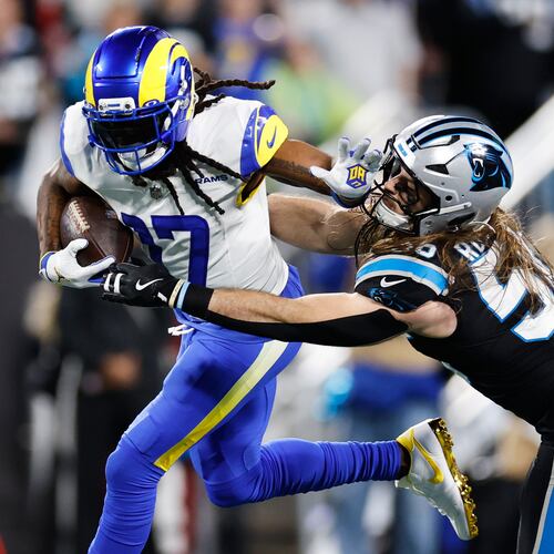 Los Angeles Rams wide receiver Davante Adams (17) is tackled by Carolina Panthers linebacker Christian Rozeboom during the second half of an NFL wild-card playoff football game, Saturday, Jan. 10, 2026, in Charlotte, N.C. (AP Photo/Rusty Jones)