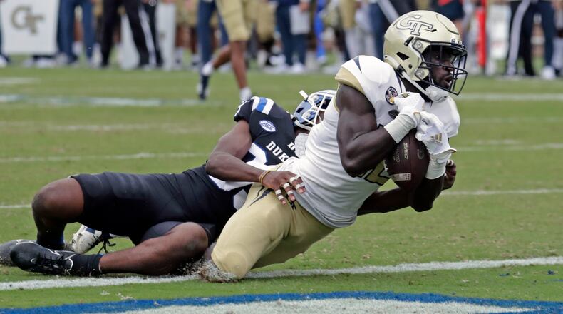 Georgia Tech wide receiver Adonicas Sanders (12) hauls in a pass for what proved to be the winning touchdown against Duke cornerback Jeremiah Lewis (39) during the second half of an NCAA college football game in Durham, N.C., Saturday, Oct. 9, 2021. (AP Photo/Chris Seward)