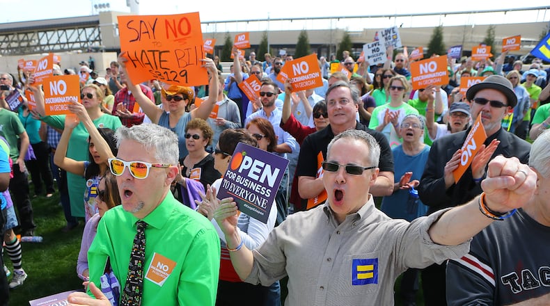 031715 ATLANTA: David Sicay-Perrow (left) and Robert Todd get vocal during a rally at the Capitol against SB 129, the "license to discriminate" legislation pushed by Sen. Josh McKoon and Rep. Sam Teasley on Tuesday, March 17, 2015, at Liberty Plaza in Atlanta. Curtis Compton / ccompton@ajc.com David Sicay-Perrow (left) and Robert Todd get vocal during a rally at the Capitol against S.B. 129, the "religious liberty" legislation pushed by state Sen. Josh McKoon last legislative session. Curtis Compton / ccompton@ajc.com