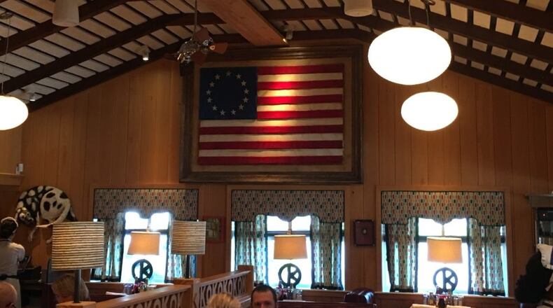 OK Cafe's owners recently replaced a wood-carving of the 1956 Georgia flag with artwork depicting the Besty Ross American flag with 13 stars in a circle. Courtesy of Tony Wilbert.