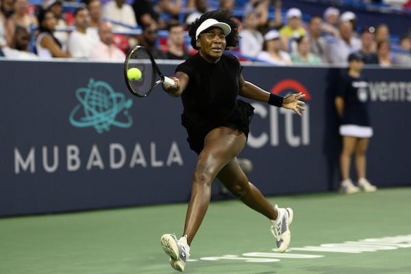 Venus Williams returns the ball against Peyton Stearns during a match at the Citi Open tennis tournament Tuesday, July 22, 2025, in Washington. (AP Photo/Nick Wass)
