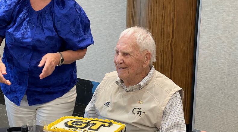 Former Georgia Tech football player Bobby Gaston, a former SEC game official, celebrates his 100th birthday with a Georgia Tech birthday cake Thursday, July 27, 2023, at Savoy Automobile Museum in Cartersville, Ga. His birthday is Oct. 18. (Photo by Chad Bishop/AJC staff)