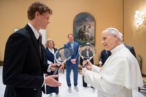 Italy's Jannik Sinner, left, shares a light moment with Pope Leo XIV on the occasion of their meeting at the Vatican, Wednesday, May 14, 2025. (Vatican Media via AP)
