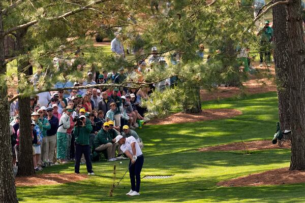 Bryson DeChambeau hits from the rough on the seventh hole during the third round at the Masters golf tournament, Saturday, April 12, 2025, in Augusta, Ga. (AP Photo/David J. Phillip)