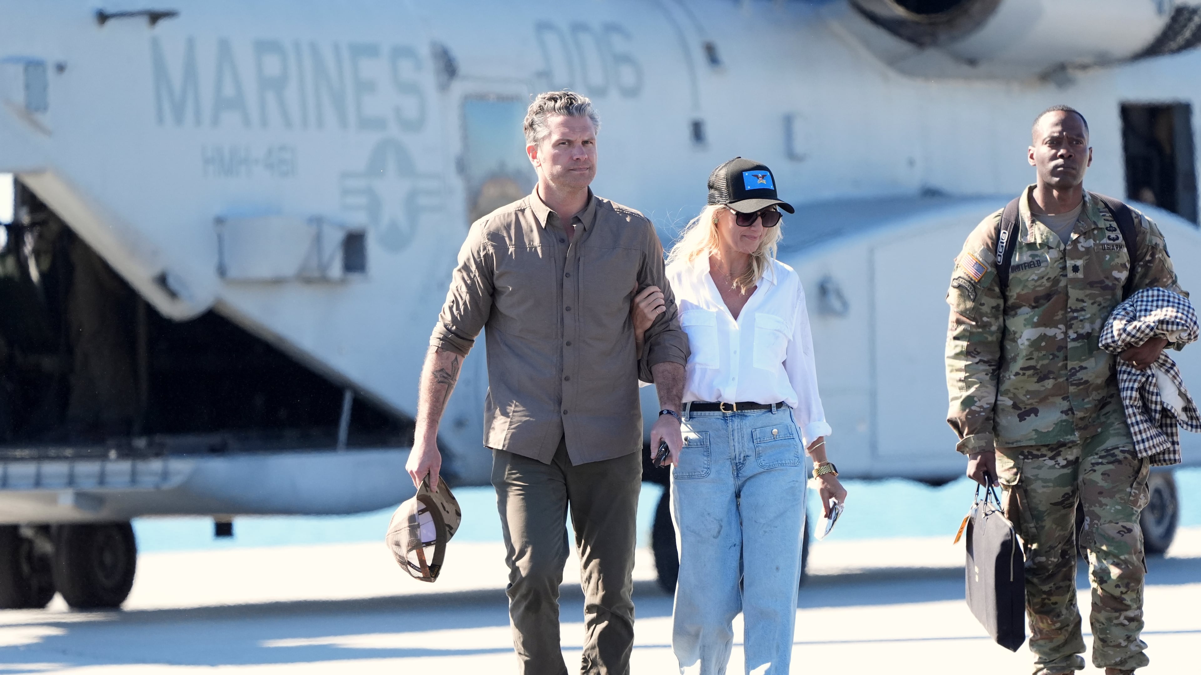 Defense Secretary Pete Hegseth, from left, and his wife Jennifer Rauchet walk during activities to mark the upcoming Marine Corps' 250th anniversary Saturday, Oct 18, 2025, on Marine Corps Base Camp Pendleton in Camp Pendleton, Calif. (AP Photo/Gregory Bull)