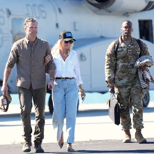 Defense Secretary Pete Hegseth, from left, and his wife Jennifer Rauchet walk during activities to mark the upcoming Marine Corps' 250th anniversary Saturday, Oct 18, 2025, on Marine Corps Base Camp Pendleton in Camp Pendleton, Calif. (AP Photo/Gregory Bull)