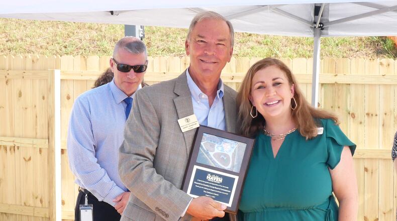 The Children’s Haven unveiled its new playground for children experiencing foster care in Cherokee County on Wednesday, Aug. 11. The project was made possible by Cherokee County Community Development Block Grant funding and what Executive Director Marcie Smith called “radical generosity” from members of the community. Pictured is Cherokee County Chairman Harry Johnston with Children’s Haven Executive Director Marcie Smith at the ribbon cutting. Smith recognized Cherokee County for the CDBG program and the program staff for assisting with the project. CONTRIBUTED