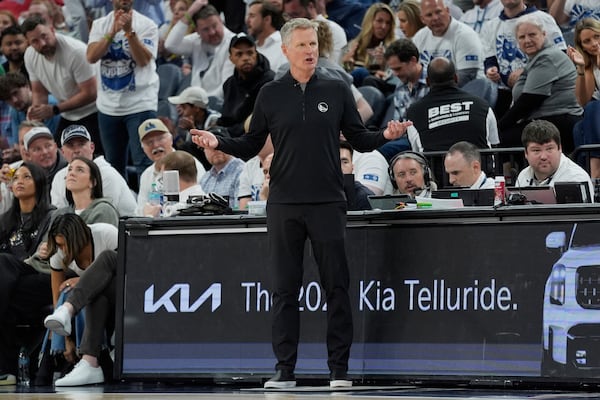 Golden State Warriors head coach Steve Kerr reacts during the second half of Game 2 of an NBA basketball second-round playoff series against the Minnesota Timberwolves, Thursday, May 8, 2025, in Minneapolis. (AP Photo/Abbie Parr)