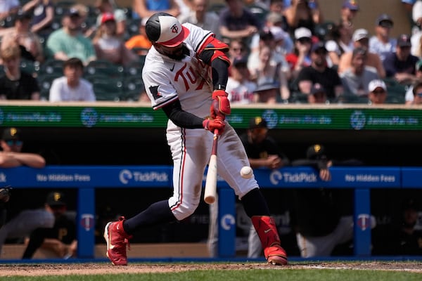 Minnesota Twins' Byron Buxton (25) hits a solo home run for the cycle during the seventh inning of a baseball game against the Pittsburgh Pirates, Saturday, July 12, 2025, in Minneapolis. (AP Photo/Abbie Parr)