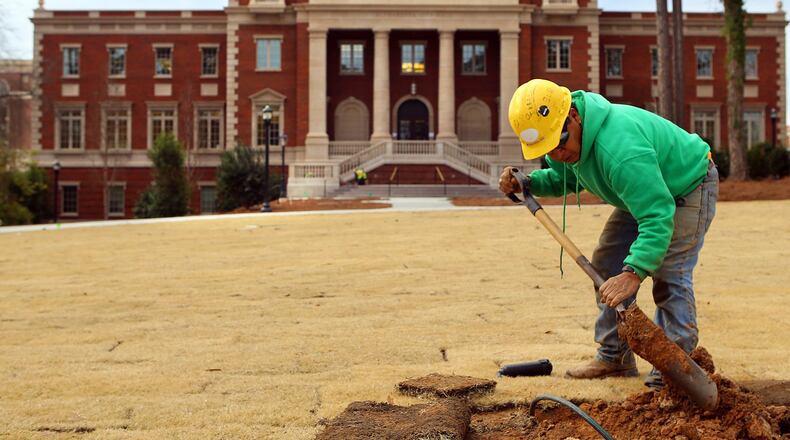 Francisco Hernandez works on the irrigation system at the new Alpharetta City Hall. The city is finishing the public parts of a new town center development, including the City Hall.