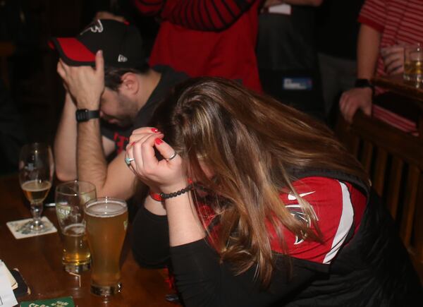 Crying in your beer: Fans in Atlanta despair as the Birds do their slow-motion train wreck in Houston. (Henry Taylor / henry.taylor@ajc.com)