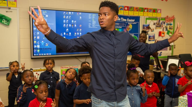 Georgia Pre-K Teacher of the Year, Johnathon Hines , works with his students at Barack H. Obama Elementary Magnet School of Technology in Atlanta on Tuesday, Oct. 15, 2019. His Teacher of the Year honor showed his pivot from a lifelong dream of playing professional basketball to a goal of showing little black boys and girls that black people can be successful outside of sports and entertainment. He’s also the first black man in the state to receive the honor. PHOTO BY PHIL SKINNER