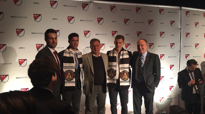 Atlanta United Technical Director Carlos Bocanegra, Oliver Shannon, Gerardo Martino, Gordon Wild and President Darren Eales post at the SuperDraft on Friday in Philadelphia.