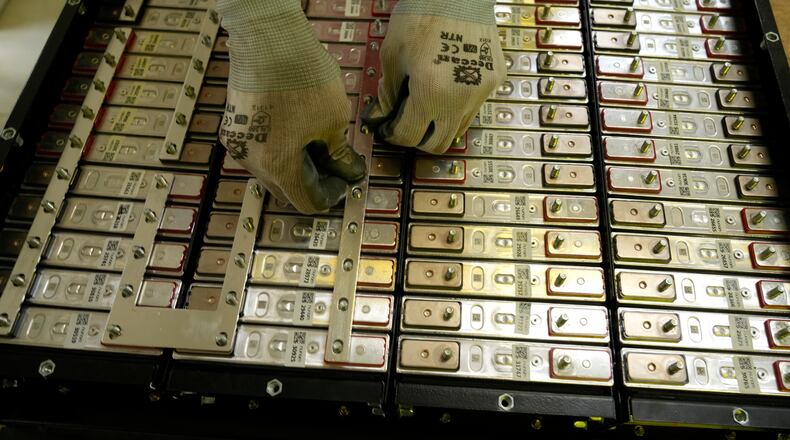 FILE - A battery production engineer at Nunam assembles a refurbished battery pack, made from used electric vehicle batteries, at their facility in Bengaluru, India, Oct. 8, 2024. (AP Photo/Aijaz Rahi, File)