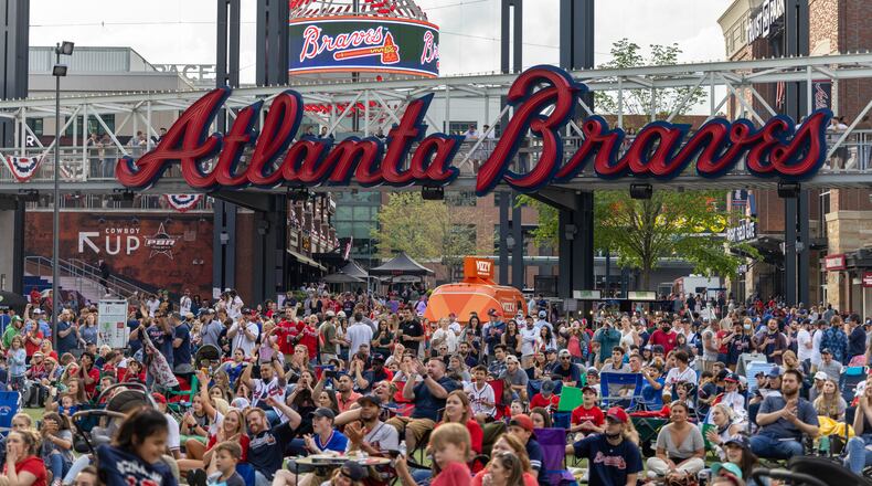 Baseball fans at Truist Park near Atlanta for the Atlanta Braves home opener against the Philadelphia Phillies, on Friday, April 9, 2021. Friday’s home opener offered some prepandemic-like excitement, but even fans who support MLB’s choice to move the All-Star game and accompanying amateur draft are sad to see it go. (Lynsey Weatherspoon/The New York Times)