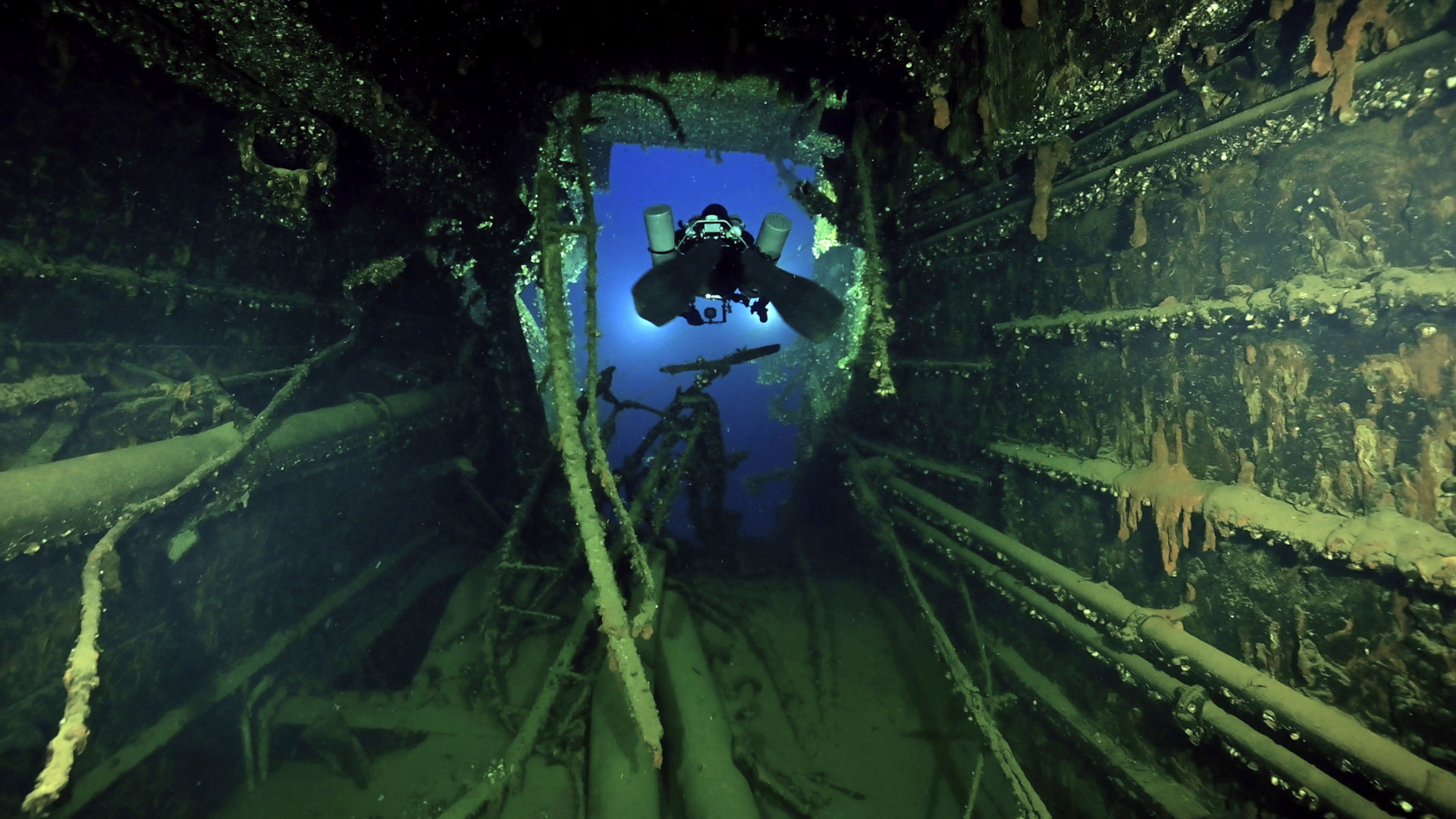 In this undated photo provided by the Greek Culture Ministry on Monday, Sept. 15, 2025, divers illuminate the wreck's interior of the Britannic, sister ship to the Titanic, for the first time since the ocean liner sank in the Aegean Sea more than a century ago after striking a mine during World War I. (Greek Culture Ministry via AP)