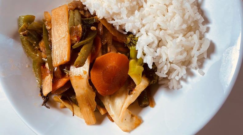 Basil stir fry is a staple with bell peppers, basil leaves, onions and green beans tossed in Thai basil chili sauce.
Bob Townsend for the Atlanta Journal-Constitution