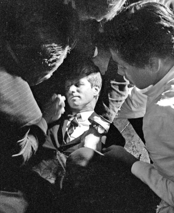 In this June 5, 1968 file photo, Juan Romero, right, helps other bystanders tend to Sen. Robert F. Kennedy as he lies on the floor of the Ambassador Hotel in Los Angeles, moments after he was shot. Romero, who was a 17-year-old busboy, was shaking the senator's hand when gunfire broke out. He held the mortally wounded Kennedy as he lay on the ground, struggling to keep the senator's bleeding head from hitting the floor. Romero died Oct. 1, 2018, at the age of 68.