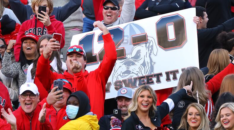 Georgia fans celebrate a 45-0 victory over Georgia Tech to remain undefeated at 12-0 on Saturday, Nov. 27, 2021, in Atlanta.   (Curtis Compton / Curtis.Compton@ajc.com)`