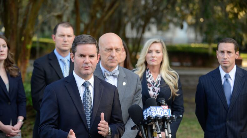 Lead prosecutor Chuck Boring (foreground) and (to Boring's left) Cobb County District Attorney Vic Reynolds, prosecutor Susan Treadaway and prosecutor Jesse Evans speak with the media outside the courthouse in Brunswick. (John Carrington / for the AJC)