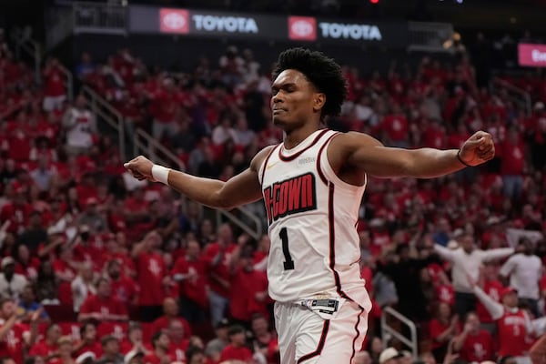 Houston Rockets' Amen Thompson (1) celebrates during the first half of Game 7 of an NBA basketball first-round playoff series against the Golden State Warriors Sunday, May 4, 2025, in Houston. (AP Photo/Ashley Landis)