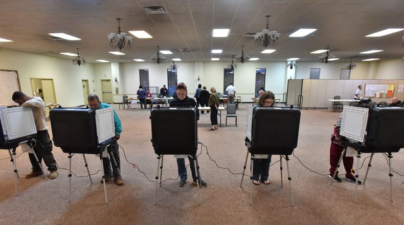 Gwinnett County residents cast their votes at First Baptist Church of Lilburn on Tuesday, November 8, 2016. HYOSUB SHIN / HSHIN@AJC.COM