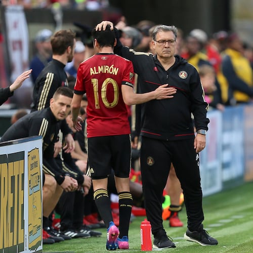 MARCH 18, 2017 Atlanta, Atlanta United Coach Gerardo 'Tata' Martino greets Miguel Almiron after he was replaced for a sub player.