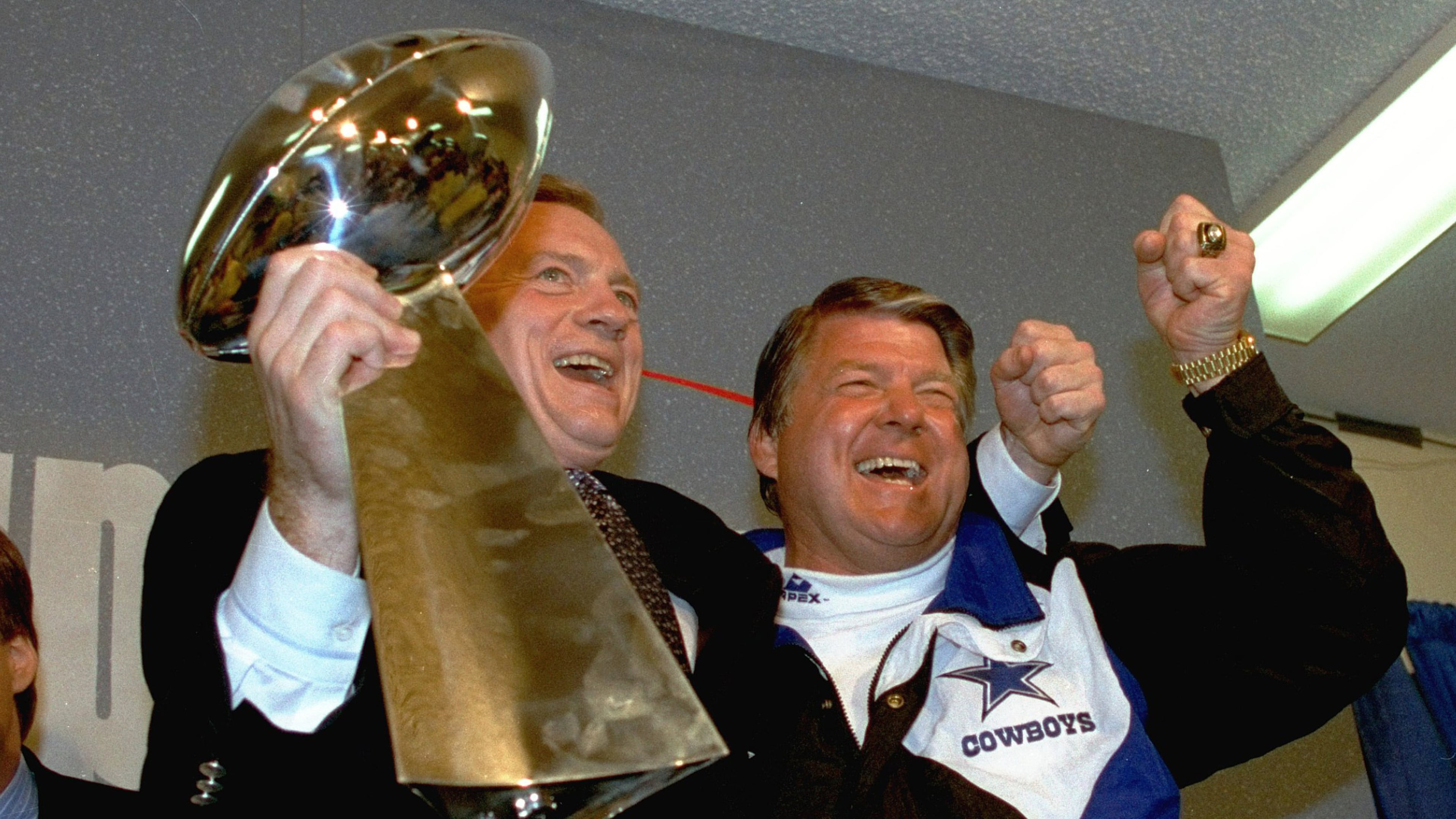 FILE - In this Jan. 31, 1993 file photo, Dallas Cowboys head coach Jimmy Johnson, right, and owner Jerry Jones, hold up the Vince Lombardi Trophy as they celebrate their 52-17 win over the Buffalo Bills in Super Bowl XXVII in Pasadena, Calif. (AP Photo/Rick Bowmer, File)