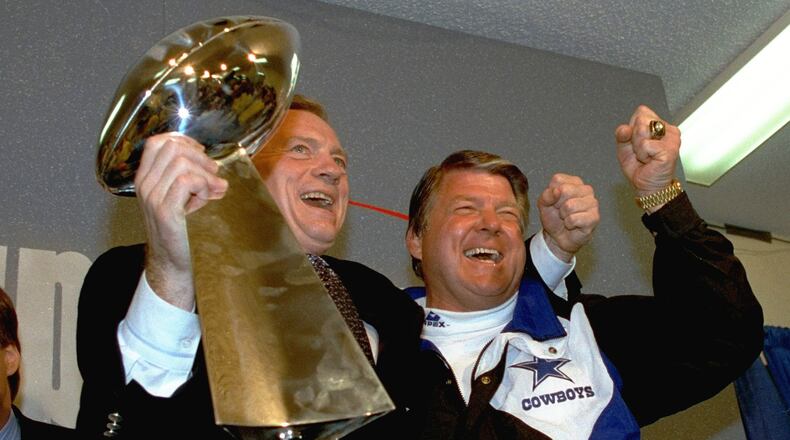 FILE - In this Jan. 31, 1993 file photo, Dallas Cowboys head coach Jimmy Johnson, right, and owner Jerry Jones, hold up the Vince Lombardi Trophy as they celebrate their 52-17 win over the Buffalo Bills in Super Bowl XXVII in Pasadena, Calif. (AP Photo/Rick Bowmer, File)