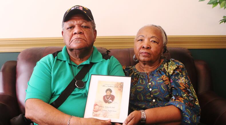 John Golden and his wife hold up the funeral program for his mother, Curliene Golden, at a press conference on Tuesday, July 9, 2019, in Jonesboro, Ga., where Golden and his attorney, Terance Madden, discussed an alleged sexual assault of Golden’s mother at Governor’s Glen Assisted Living Facility in Clayton County. On September 5, 2018, Curliene Golden, a 94-year-old woman, communicated that she was assaulted/raped. No one has been charged and the family is offering an award for more information. Golden has since died. (photo credit: Christina Matacotta/Christina.Matacotta@ajc.com)