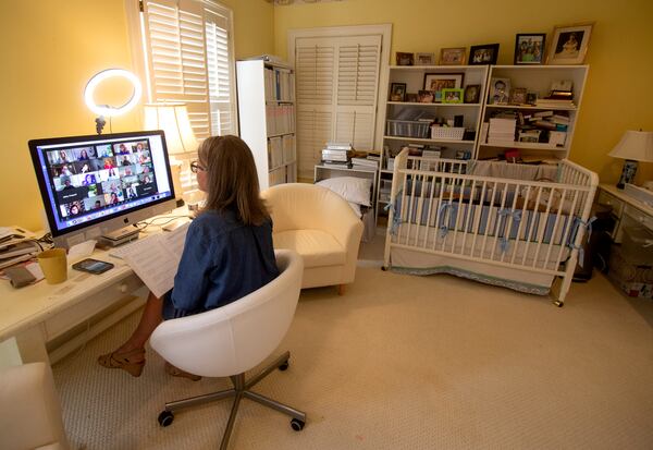 Nancy McGuirk talks with the leaders of her women's Bible study class during a Zoom call at her Atlanta home Monday, March 15, 2021. (Steve Schaefer for The Atlanta Journal-Constitution) 