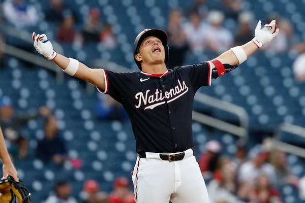 Washington Nationals' Alex Call celebrates his triple hit against Atlanta Braves pitcher AJ Smith-Shawver during the third inning of a baseball game in Washington, Thursday, May 22, 2025. (AP Photo/Terrance Williams)