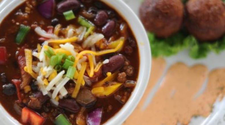 Jamaican jerk chili, served with jalapeno corn fritters, brought Food Network to the Highlander.