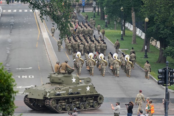 A military parade commemorating the Army's 250th anniversary, coinciding with President Donald Trump's 79th birthday, Saturday, June 14, 2025, in Washington. (AP Photo/Stephanie Scarbrough)