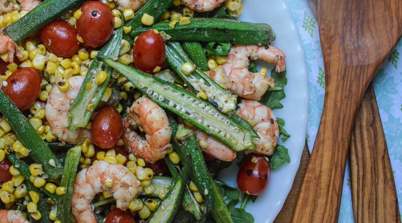 Skillet roasted okra, shrimp, corn and tomatoes on a bed of arugula.
(Virginia Willis for The Atlanta Journal-Constitution)