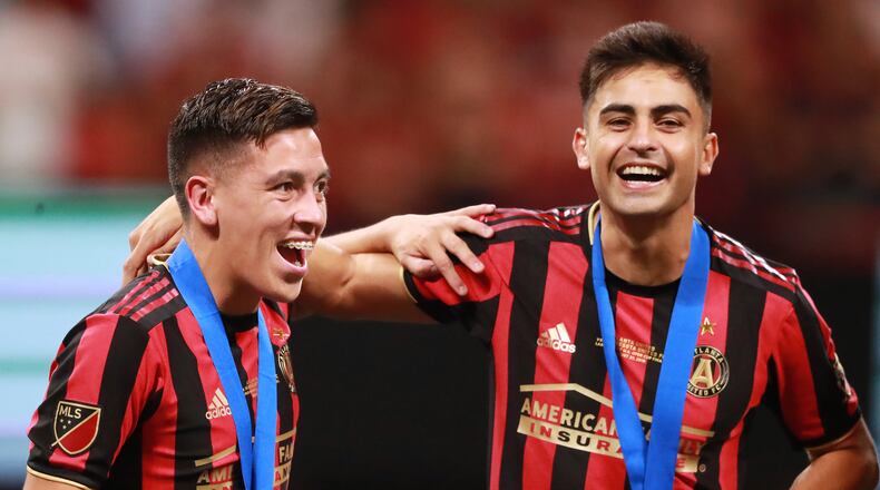August 27, 2019 Atlanta: Atlanta United players Ezequiel Barco (left) and Pity Martinez celebrate beating Minnesota United 2-1 to win the U.S. Open Cup on Tuesday, August 27, 2019, in Atlanta. Curtis Compton/ccompton@ajc.com
