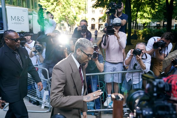 Grammy-winning singer Chris Brown makes his way into Southwark Crown Court, in London, Friday, July 11, 2025.(AP Photo/Alberto Pezzali)