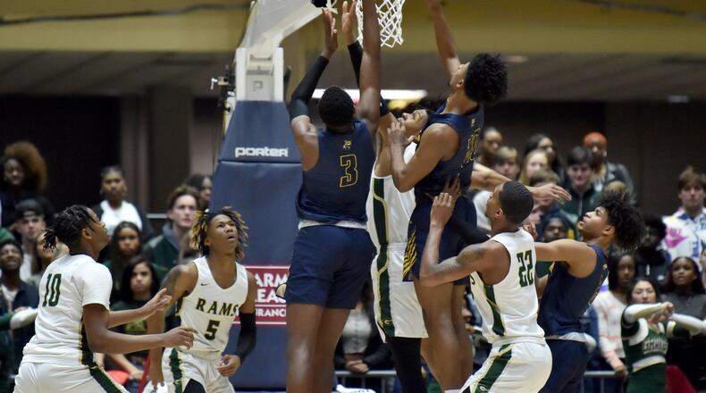 Wheeler's Ja'Hiem Hudson (3) shoots over Grayson's Toneari Lane (22) during 2020 GHSA State Basketball Class Championship game at the Macon Centreplex in Macon on Saturday, March 7, 2020. Westlake won 72-53 over Collins Hill. (Hyosub Shin / Hyosub.Shin@ajc.com)