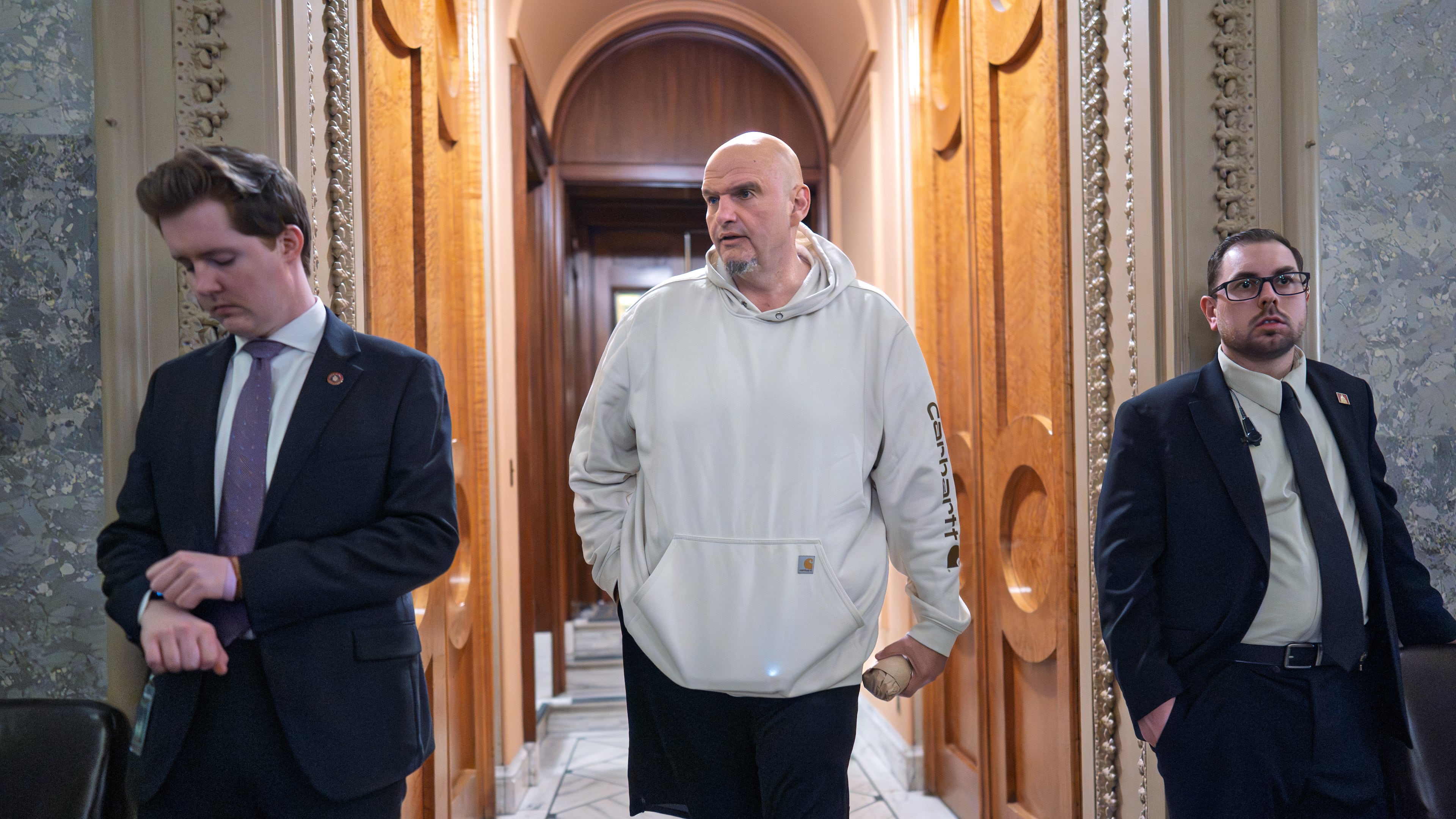 Sen. John Fetterman, D-Pa., a Democrat who has been voting to open the government, leaves the chamber as the Senate works to bring the longest government shutdown in U.S. history to an end after a bipartisan compromise, at the Capitol in Washington, Monday, Nov. 10, 2025. (AP Photo/J. Scott Applewhite)
