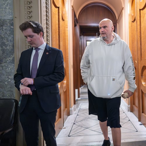 Sen. John Fetterman, D-Pa., a Democrat who has been voting to open the government, leaves the chamber as the Senate works to bring the longest government shutdown in U.S. history to an end after a bipartisan compromise, at the Capitol in Washington, Monday, Nov. 10, 2025. (AP Photo/J. Scott Applewhite)