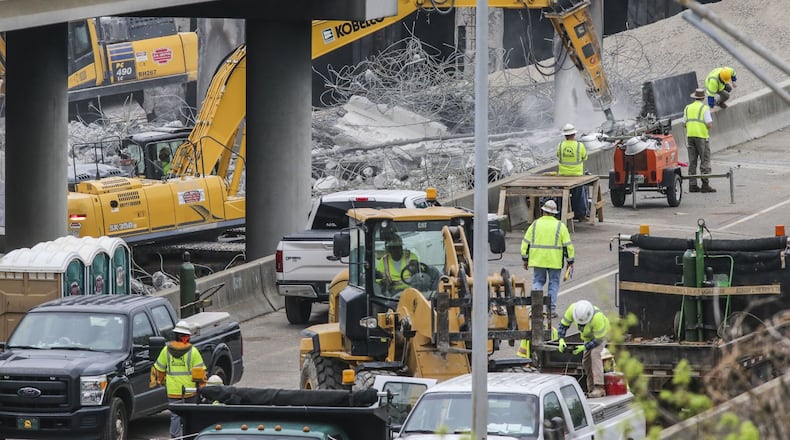 Construction crews continue to work around the clock Monday morning, April 3, 2017 as the commute around the gaping hole in I-85 wasn’t as bad as some expected.