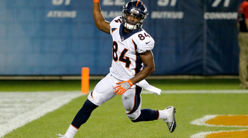 Denver Broncos wide receiver Isaiah McKenzie (84) celebrates a touchdown reception during the second half of an NFL preseason football game against the Chicago Bears, Thursday, Aug. 10, 2017, in Chicago. (AP Photo/Charles Rex Arbogast)