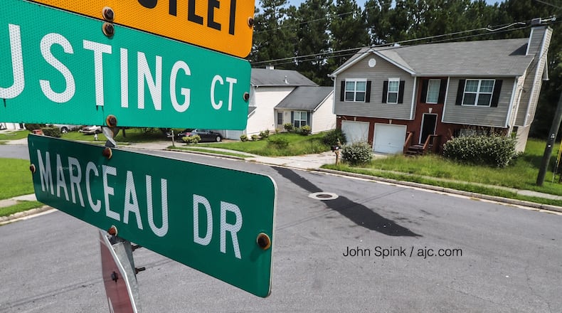 The GBI is investigating an officer-involved shooting in the 1800 block of Marceau Drive near Conley, a spokeswoman said. The oil slick marks the spot where a woman hit a police officer and pinned him against a patrol car.