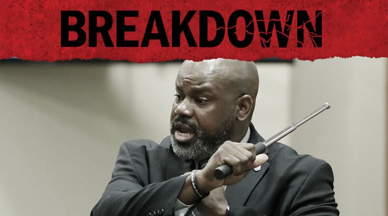 DeKalb Police Sgt. J.K. Walker, who trained former DeKalb County Police Officer Robert "Chip" Olsen, testifies use of force policies and demonstrates the use of an expandable baton at Olsen's murder trial.  (Bob Andres / robert.andres@ajc.com)